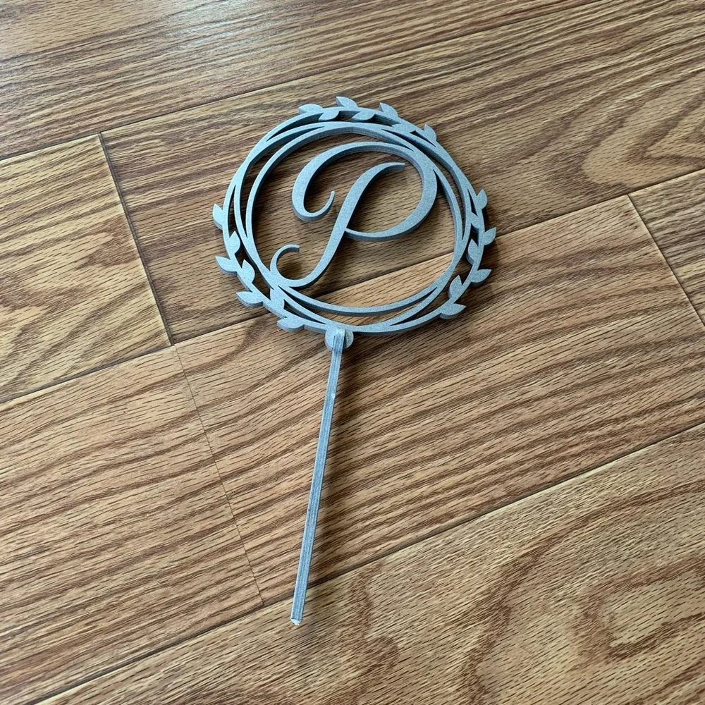 Silver “P” cake topper